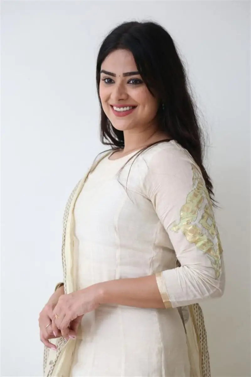 Telugu Actress Priyanka Sharma Smiling Stills in White Dress